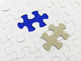 Missing piece of white puzzle and reveal blue color.