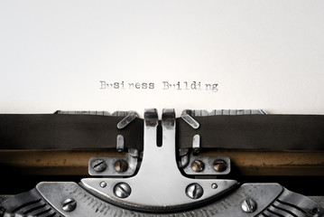 "Business Building" written on an old typewriter