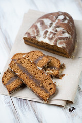 Vertical shot of a sliced honey-cake, high angle view