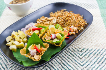 Leaf wrapped bite size appetizer.