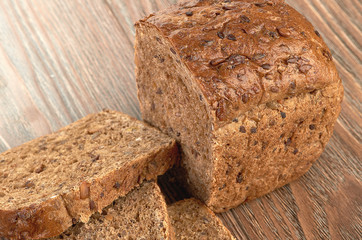 Slices of brown bread on a wooden table