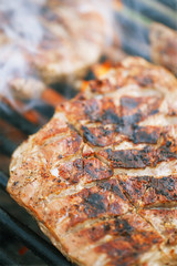 marinated juicy pork ribs on grill