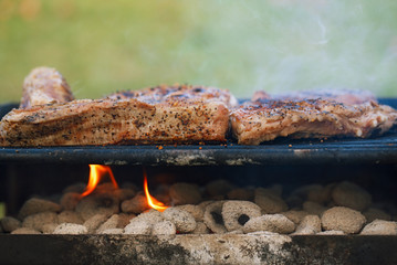 marinated juicy pork ribs on grill