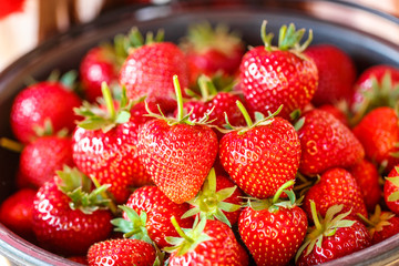 Red juicy fresh strawberries closeup in a basket