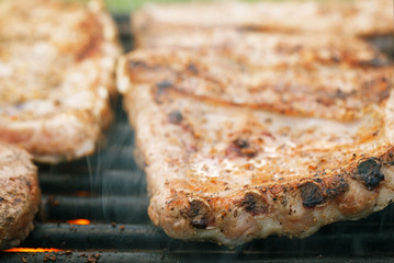 marinated juicy pork ribs on grill