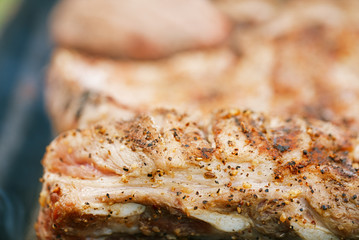 marinated juicy pork ribs on grill