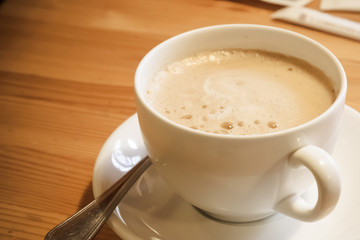 Coffee cup on wood table