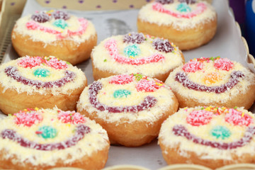 A lot of donut and strawberry jam