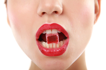 woman sucking cute sweet candy closeup