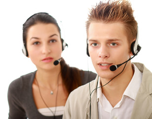 Attractive young people working in a call center