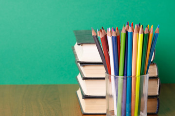 books and pencils on the desk.