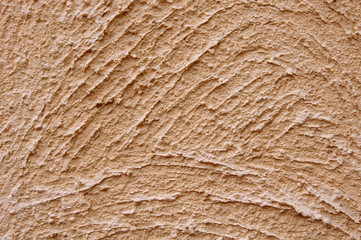 Orange rough plaster on wall