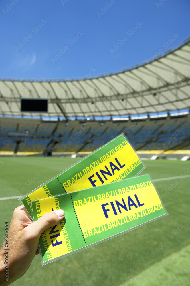 Wall mural Soccer Fan Holding Two Brazil Final Tickets at the Stadium