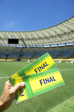 Soccer Fan Holding Two Brazil Final Tickets at the Stadium