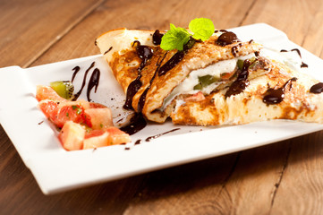 Sponge Pancakes with cheese, fruit, chocolate and mint