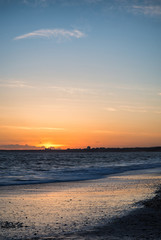 Stunning sunset over beach long exposure landscape