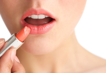 Naklejka premium Young woman half face with lipstick