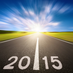 Fototapeta premium Motion blurred asphalt road forward to 2015