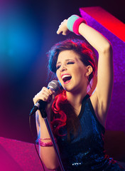 Pop star with hand raised