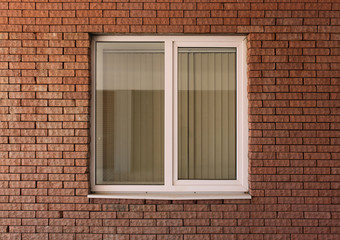 Modern residential window in brick wall