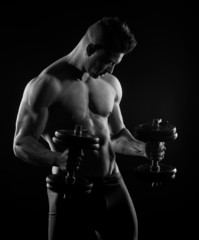 Fototapeta na wymiar Muscular man weightlifting
