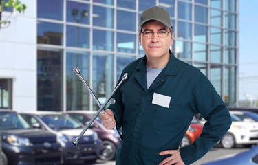 Auto mechanic with wrench.