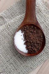instant coffee and sugar in spoon