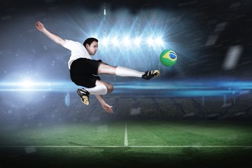 Fototapeta na wymiar Composite image of football player in white kicking