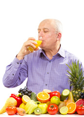 Mature man drinking juice