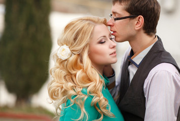 Loving man and woman kiss