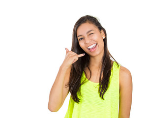 Young friendly, single woman giving call me sign, gesture