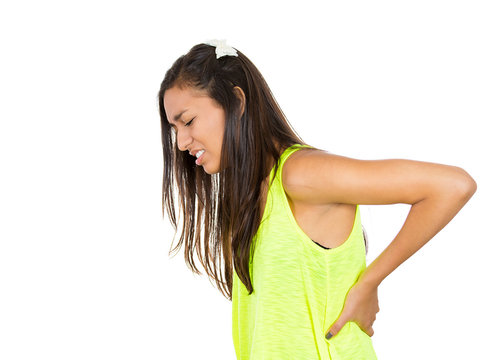 Young woman with back pain, ache on white background
