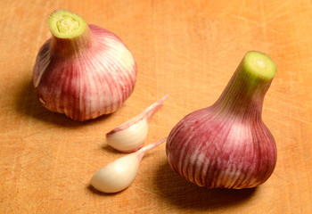 Fresh Garlic over a wooden cutting board