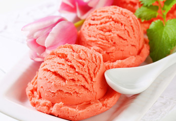 Scoops of fruit sherbet and fresh tulips