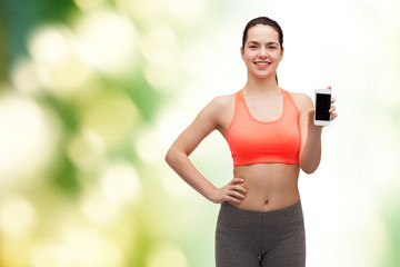 Fototapeta premium sporty woman with smartphone