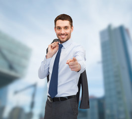 handsome buisnessman with jacket over shoulder