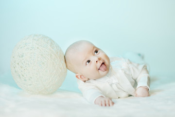 boy and marble on a blue background