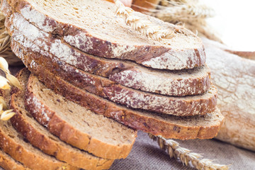 Loaf of bread sliced ​​with crispy rolls