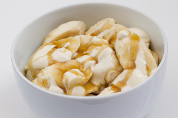 sliced bananas and yogurt in a bowl