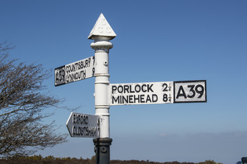 vintage metal road direction sign on top of Porlock Hill