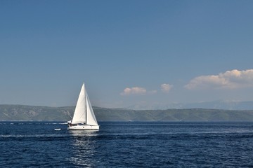 Obraz premium White boat alone on open blue adriatic sea. Croatia