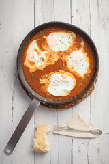 Poached eggs with tomato sauce