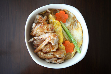 Grilled Chicken teriyaki rice on wood background