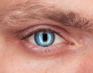 Close-up of blue eye a man - Powered by Adobe