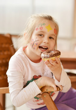 Little Girl Eating Donut