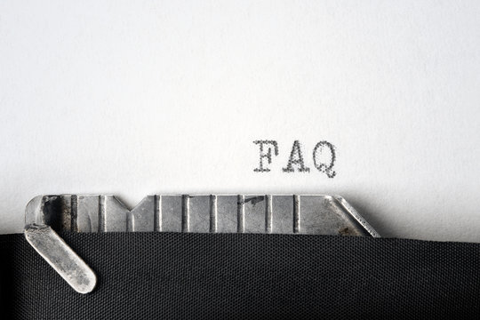 "FAQ" written on an old typewriter. Closeup.