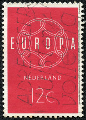 stamp printed in Netherlands, shows a chain composition