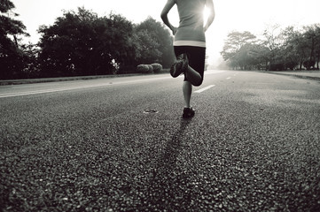 Runner athlete running on road