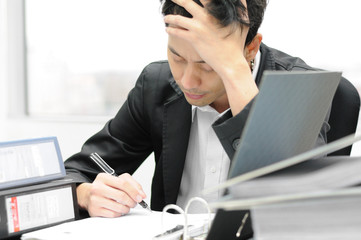 Thoughtful or stressful businessman at work © tigger11th