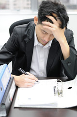Thoughtful or stressful businessman at work © tigger11th